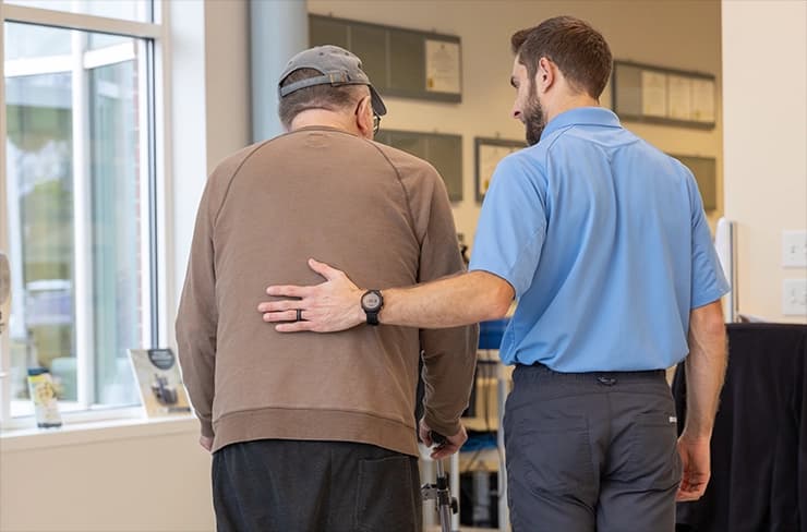 Man helping older man