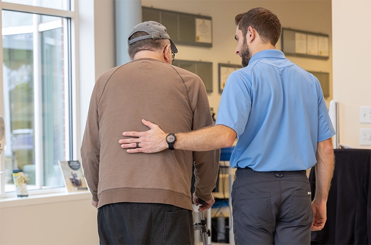 Man helping older man