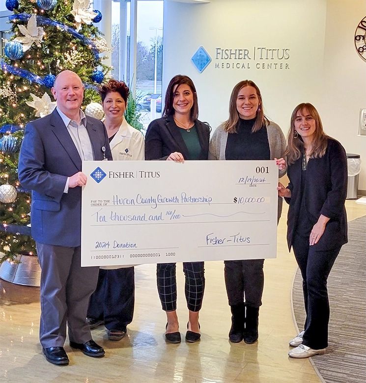 Fisher-Titus staff presenting a $10,000 donation check to Huron County Growth Partnership