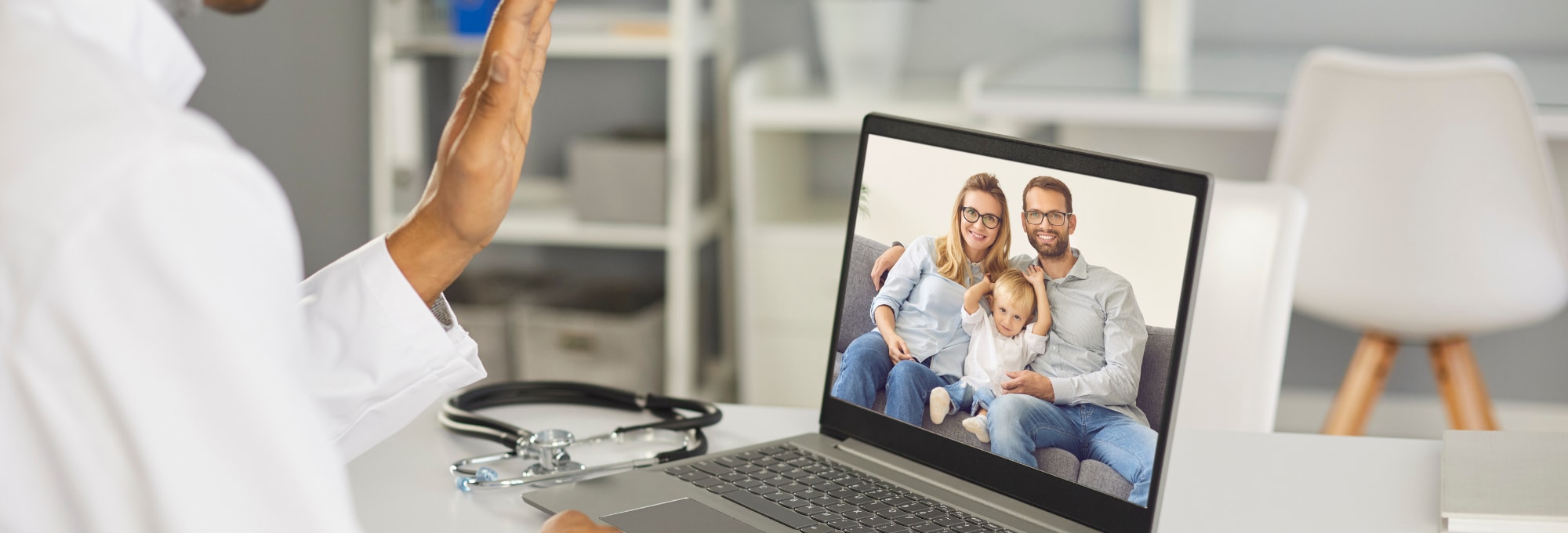 Doctor completing Virtual Visits with a family.