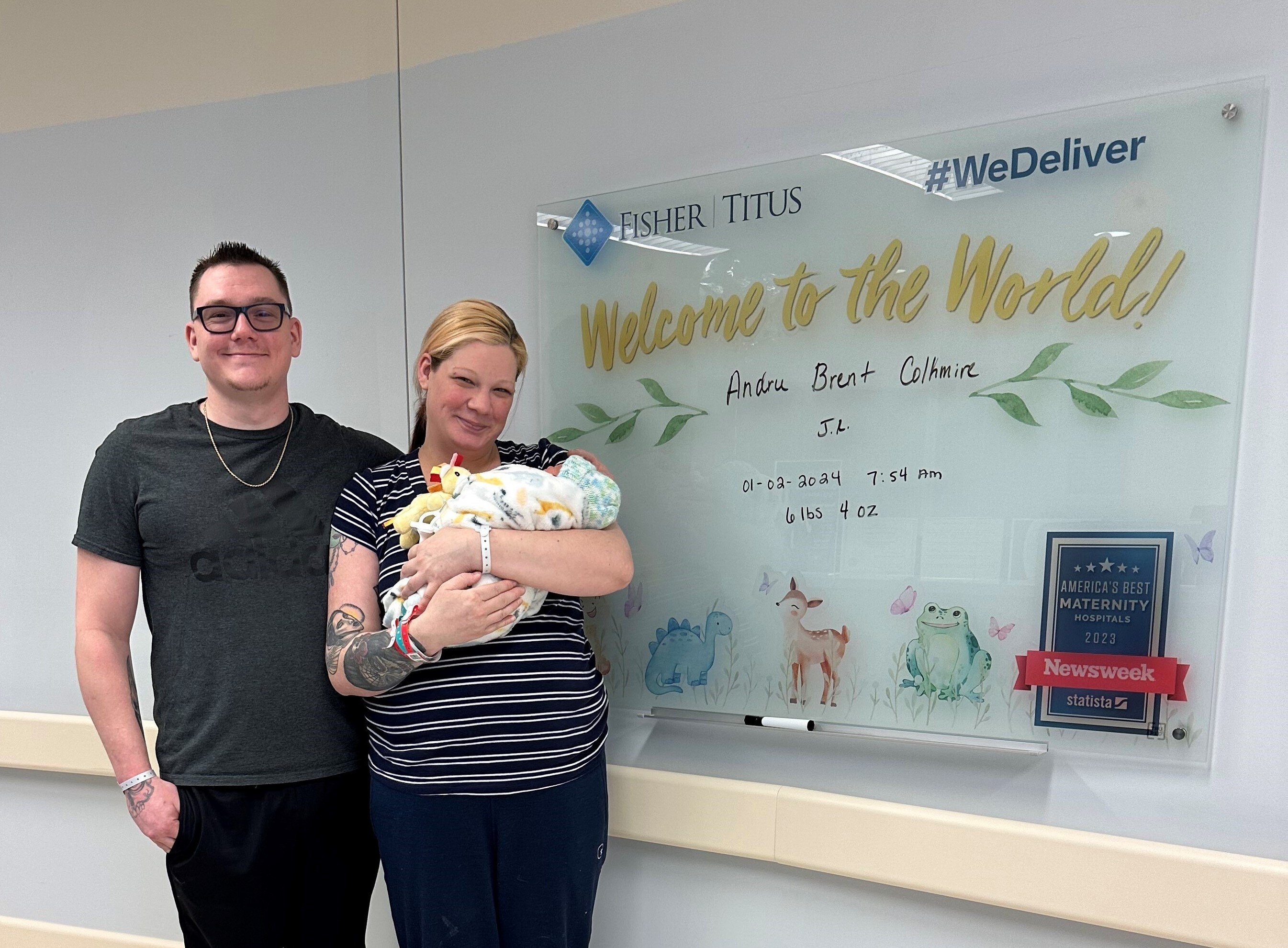 Andru Colkmire Sr. and Sarah DuPrae pose for a picture with their newborn son, Andru Colkmire Jr.