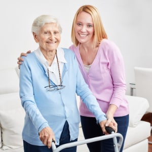 Daughter caring for senior mother.