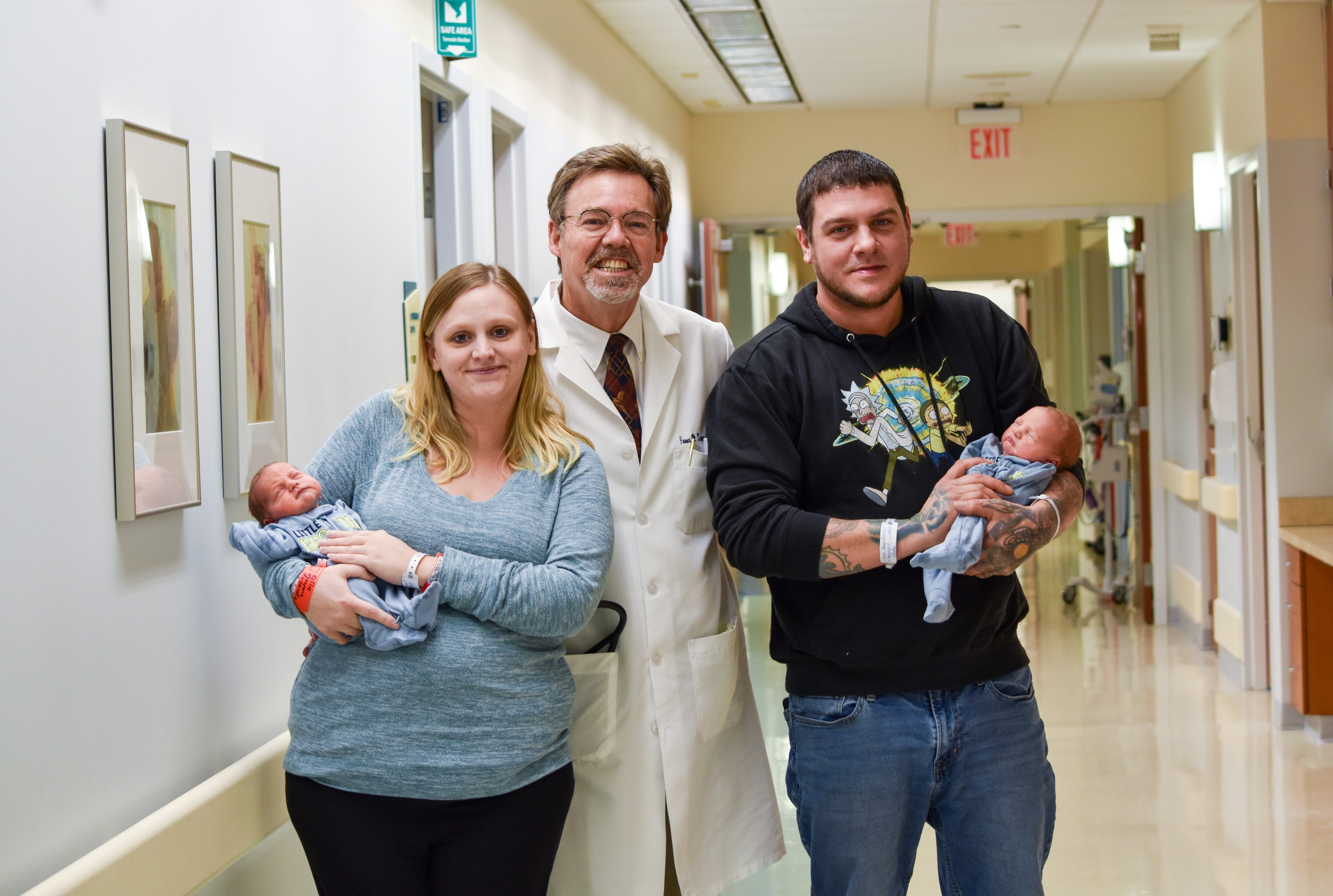 Dr. Kasten poses with the Lewis'