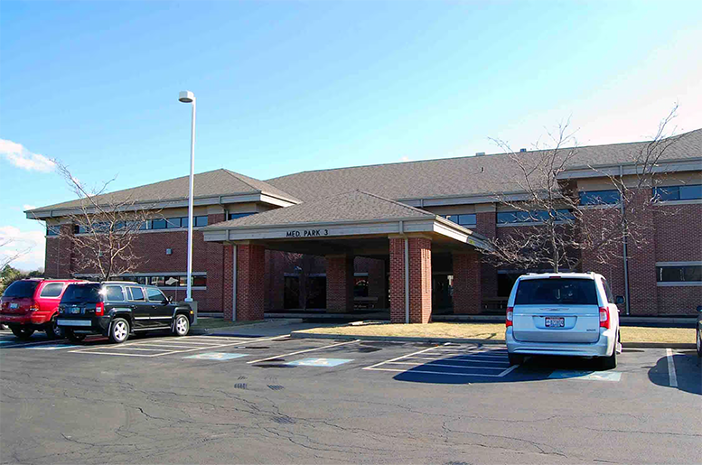 Exterior of Med Park 3 medical office building with brick facade and parking lot